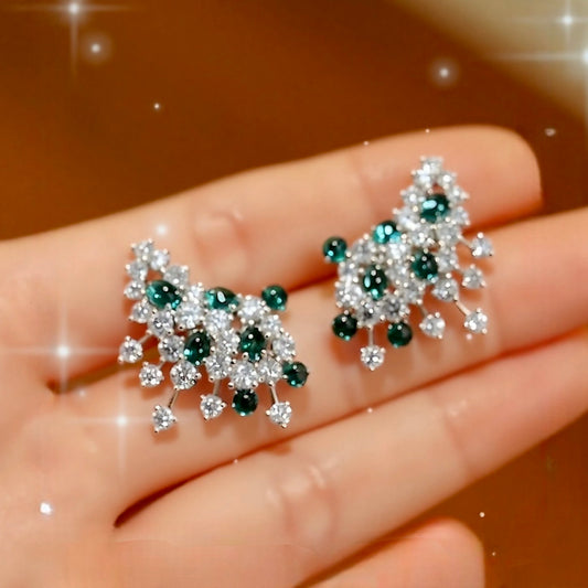 Sylira statement earrings with lab-grown emeralds and diamonds in a white gold floral design








