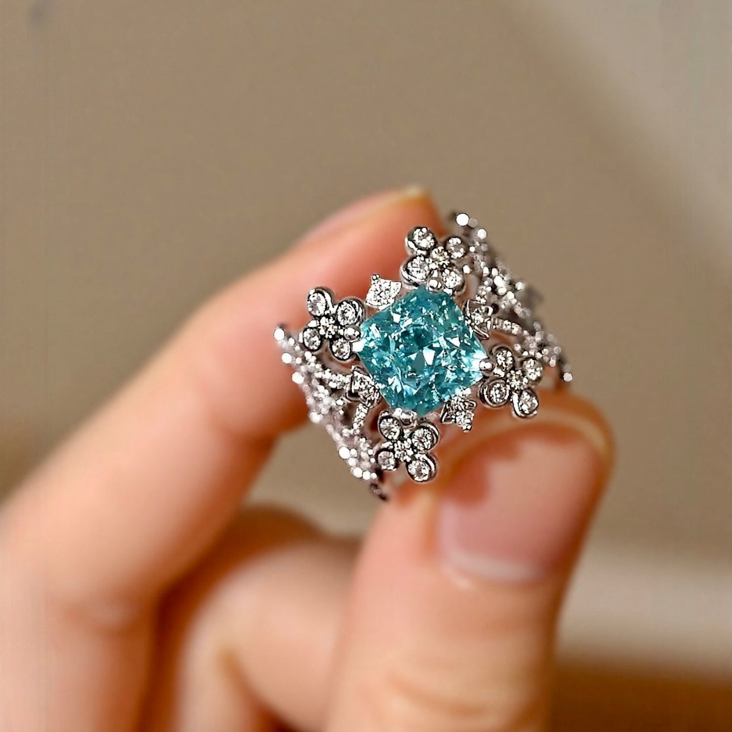 Lab grown blue diamond floral ring with intricate filigree design

