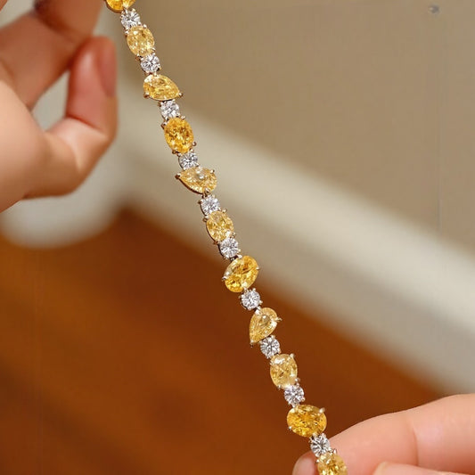 Charisse bracelet with lab-grown yellow diamonds and white diamond accents in pear and oval shapes








