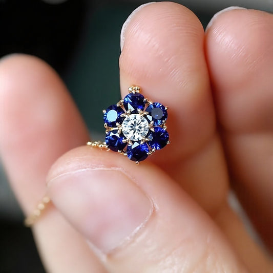 Gold flower necklace with lab diamond and blue sapphires in 18k gold setting








