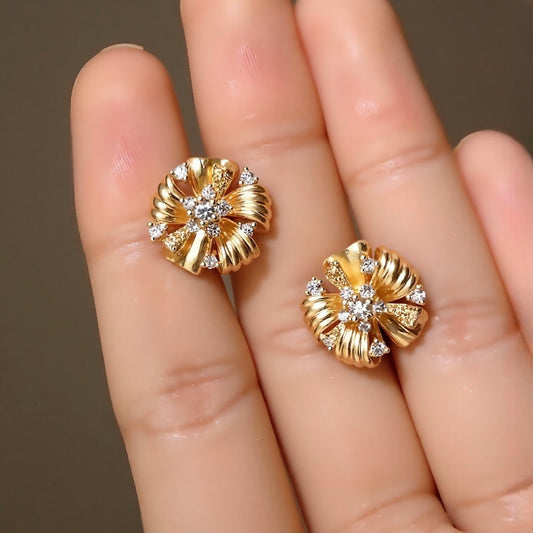 Vintage floral earrings with twisted gold ribbons and lab-grown diamond centers

