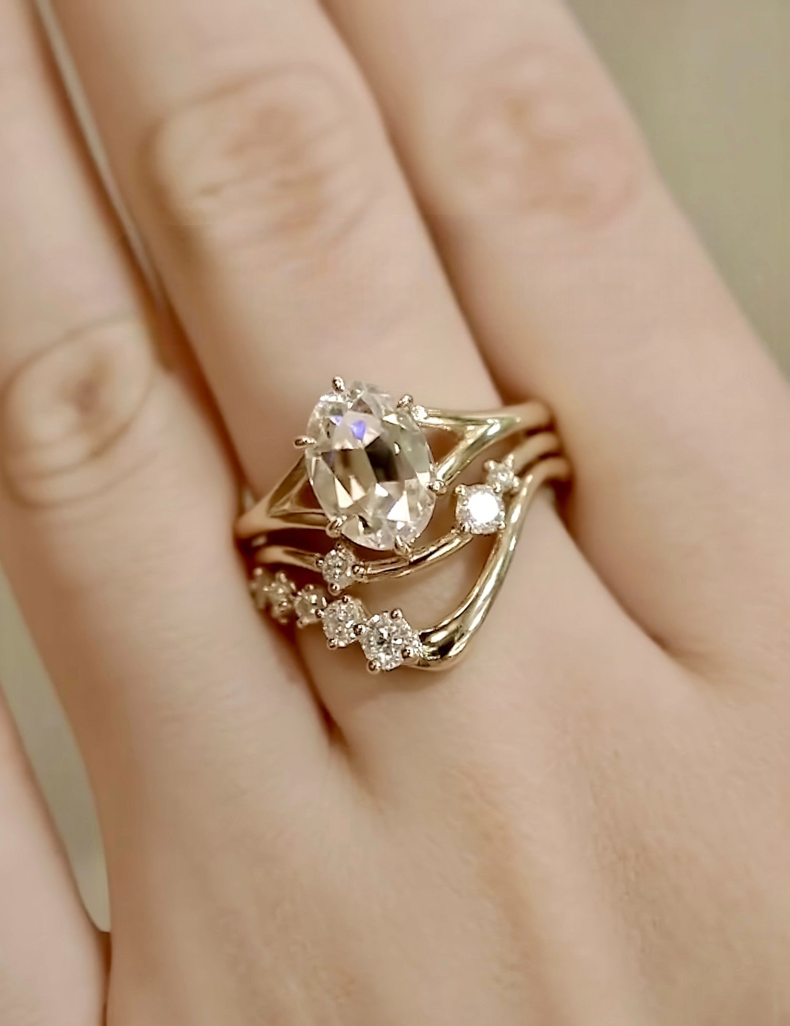 Alura ring set with 2ct lab-grown oval diamond and curved gold bands with diamond accents – organic and elegant bridal jewelry

