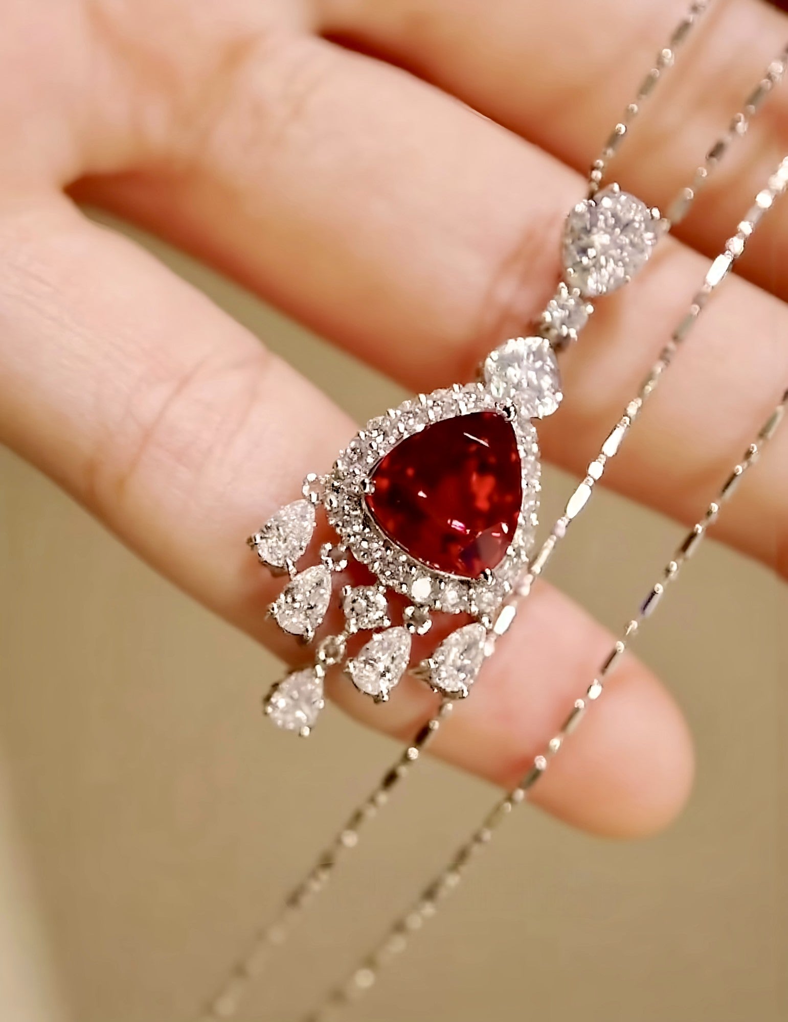 Velmira necklace with 2ct lab-grown pigeon blood ruby, diamond halo, and drop pendant design in white gold – luxury ruby fine jewelry

