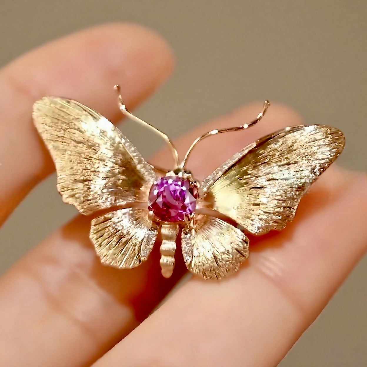 Ethelle butterfly brooch with 0.4ct lab grown purple sapphire gem








