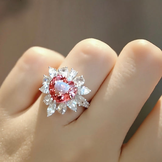 Romantic heart-shaped lab padparadscha sapphire ring with diamond halo
