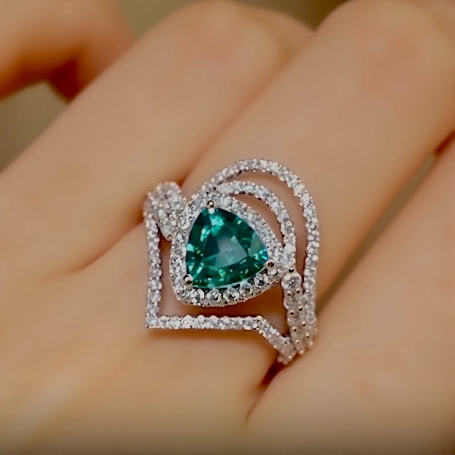 Discover the Elarin ring featuring a 2ct lab-grown paraiba in trillion cut with diamond drape halo—bold, modern, and radiant.
