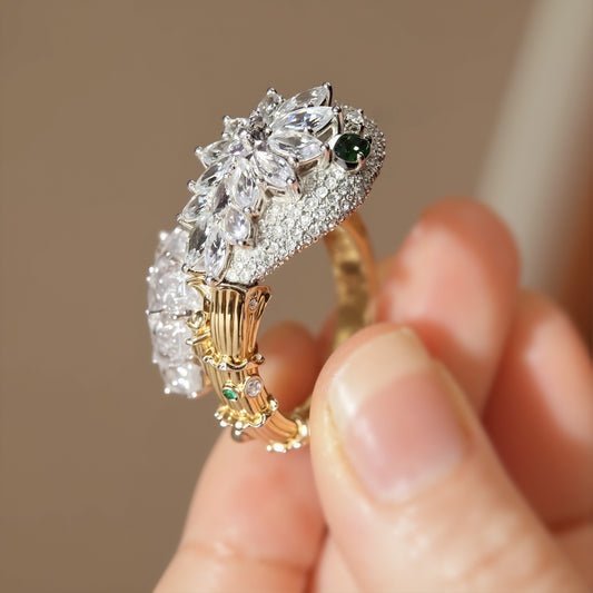Gold snake ring with lab-grown diamond scales and emerald eye

