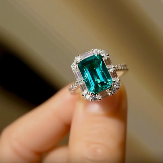 Praela ring with 4ct lab-grown emerald and diamond halo on pavé band
