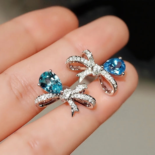 Mismatched Paraiba and aquamarine bow earrings

