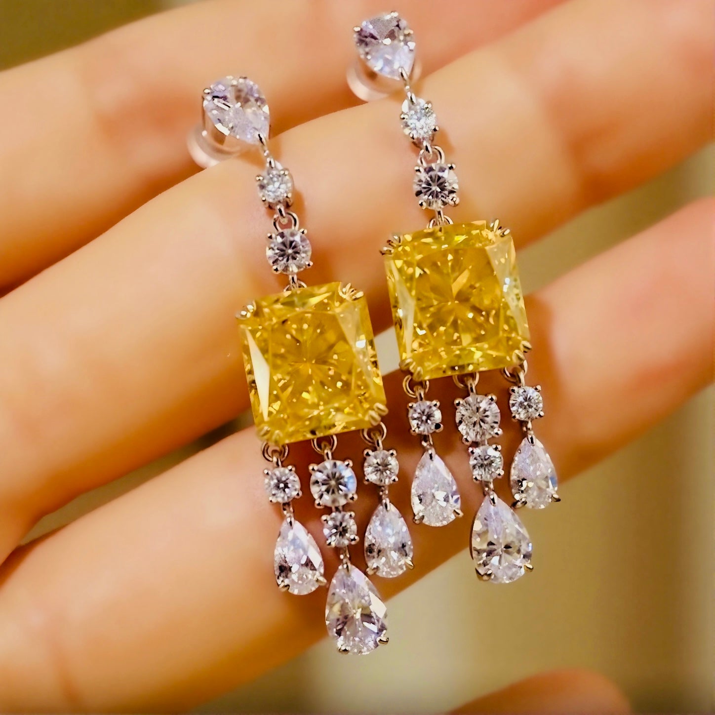 Elegant drop earrings with radiant 4ct lab-grown yellow diamonds and white diamond accents








