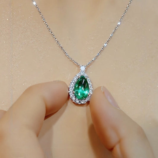 Teardrop pendant necklace with 2ct lab-grown emerald and diamond halo on white gold chain
