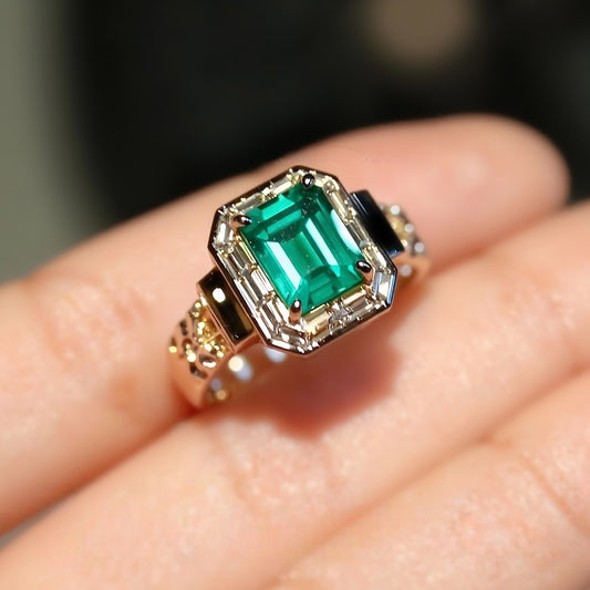 Art Deco lab emerald ring with baguette diamond halo
