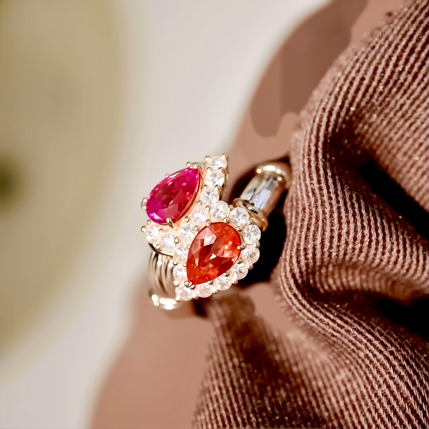 Toi et Moi gold ring with pear-cut lab pink diamond and padparadscha sapphire surrounded by diamond halos
