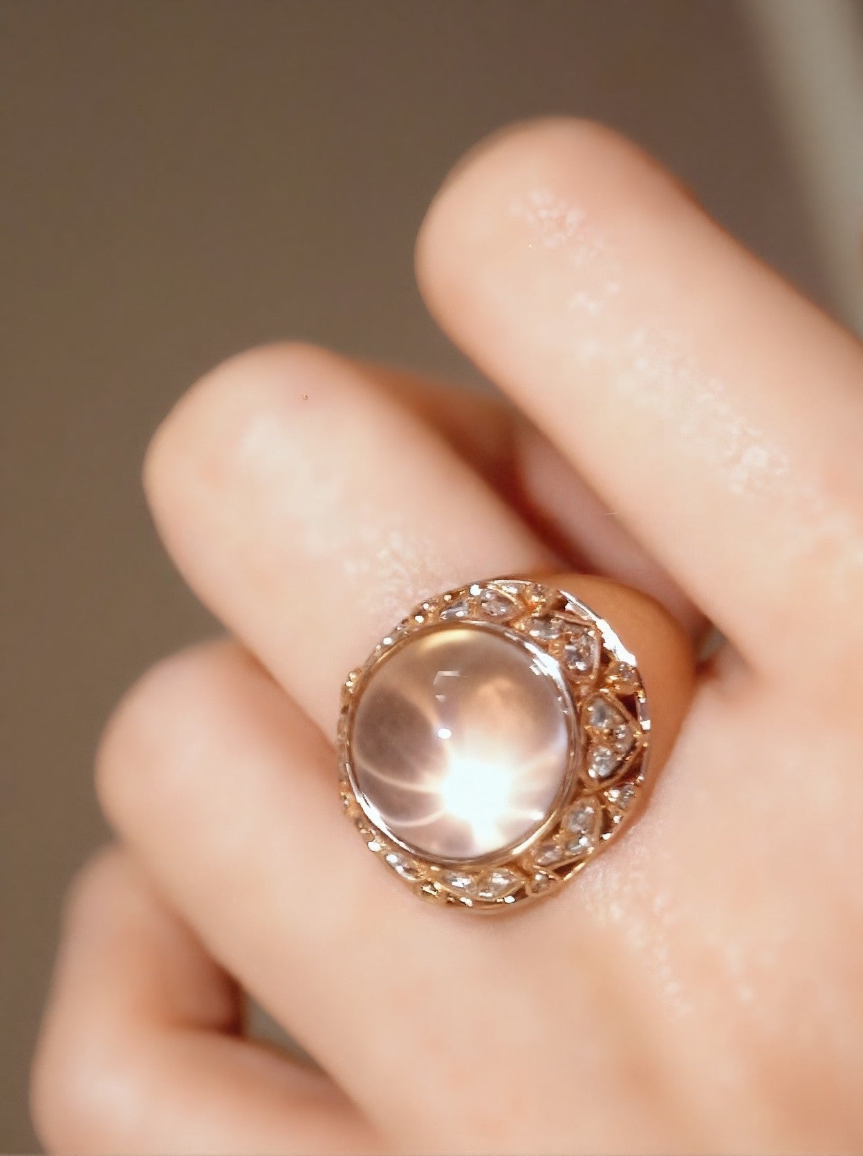 Lysira ring with natural rose quartz and diamond halo in rose gold








