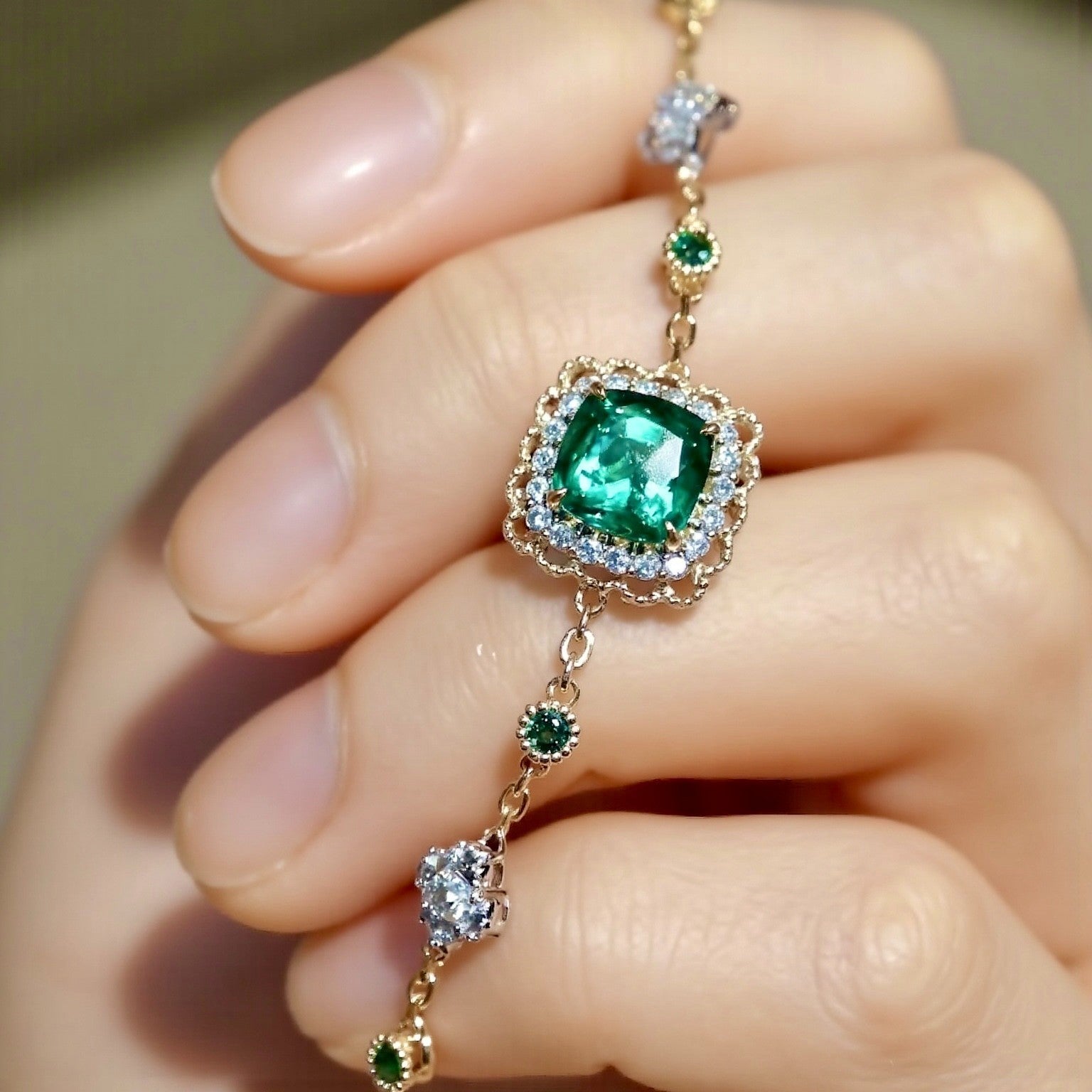 Ophira bracelet with 3ct lab-grown emerald, double diamond halo, and gemstone stations in yellow gold – luxury fine jewelry bracelet

