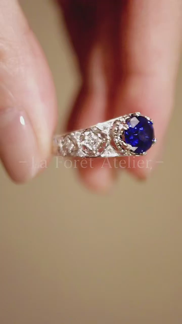 Tiranelle ring featuring 1ct lab sapphire with vintage diamond accents on silver band