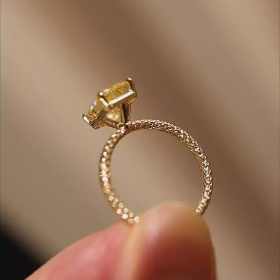 3ct radiant yellow lab-grown diamond solitaire ring with pavé diamond band in yellow gold








