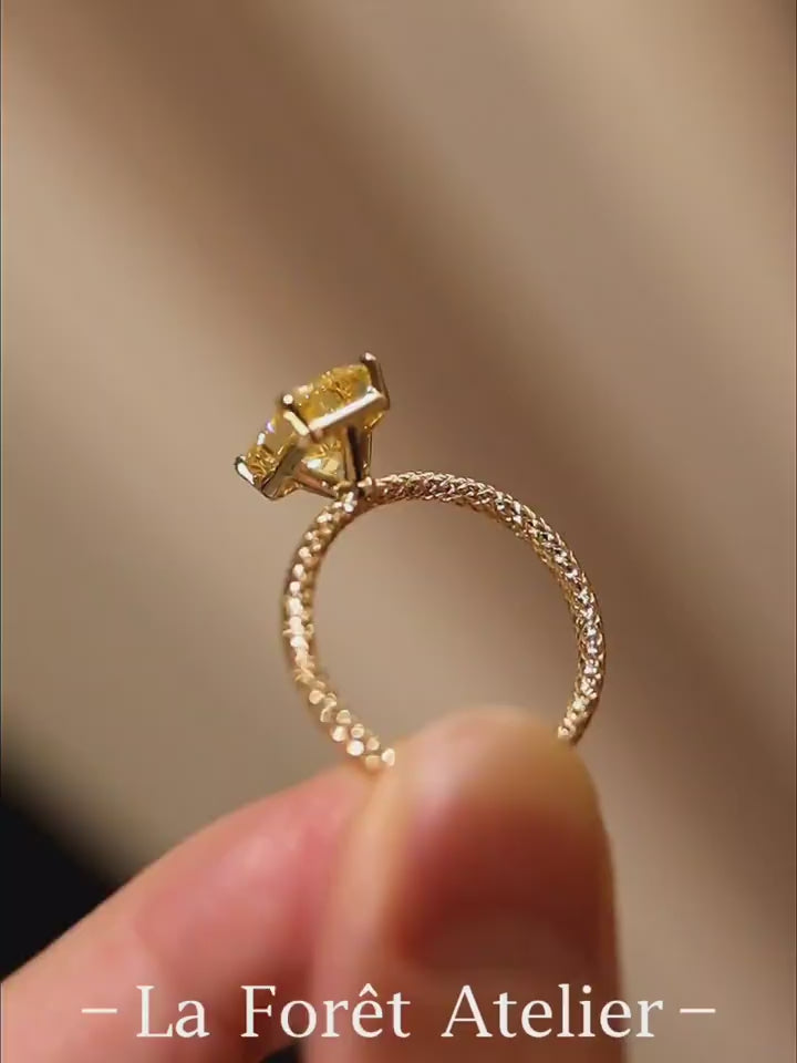 3ct radiant yellow lab-grown diamond solitaire ring with pavé diamond band in yellow gold








