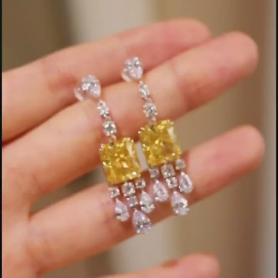 Elegant drop earrings with radiant 4ct lab-grown yellow diamonds and white diamond accents








