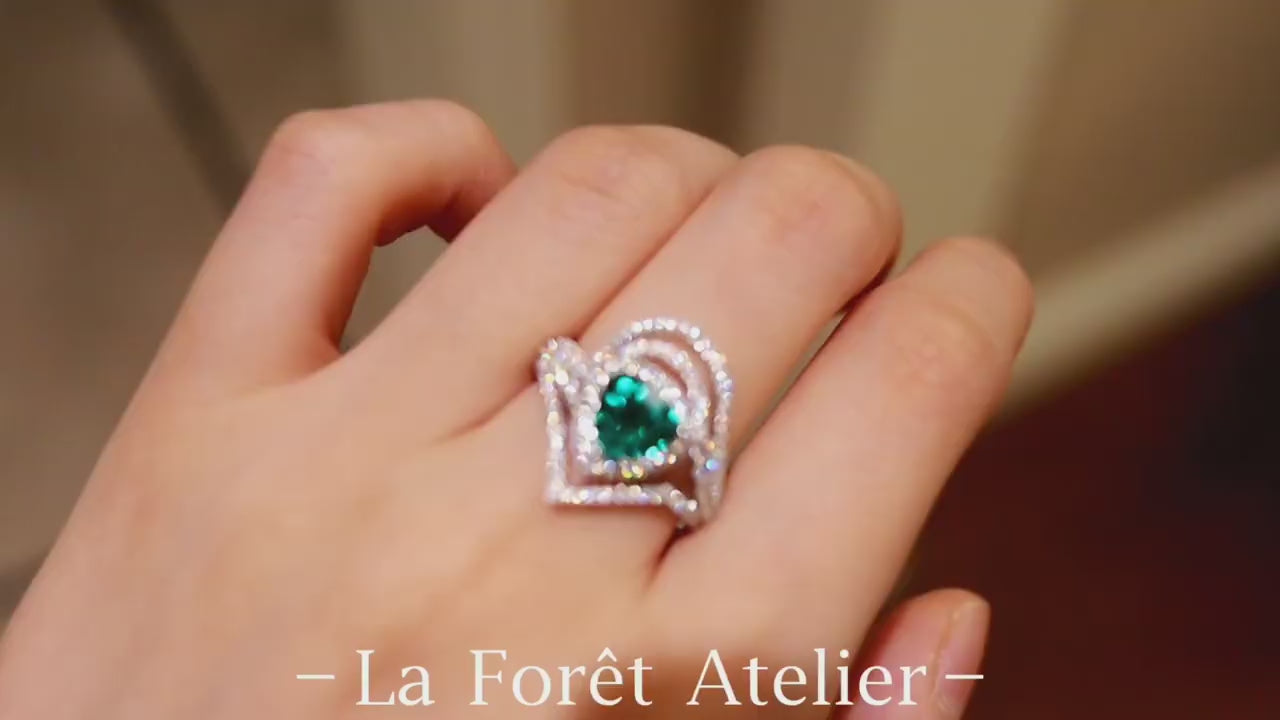 Discover the Elarin ring featuring a 2ct lab-grown paraiba in trillion cut with diamond drape halo—bold, modern, and radiant.

