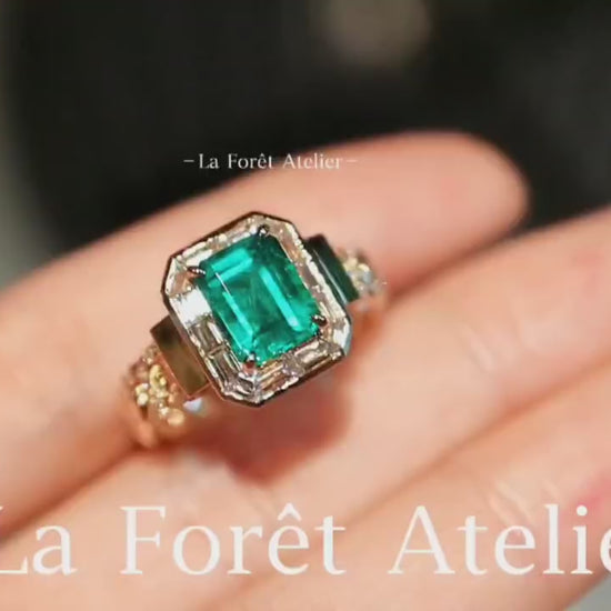 Close-up of 1.5ct lab-grown emerald ring in vintage setting