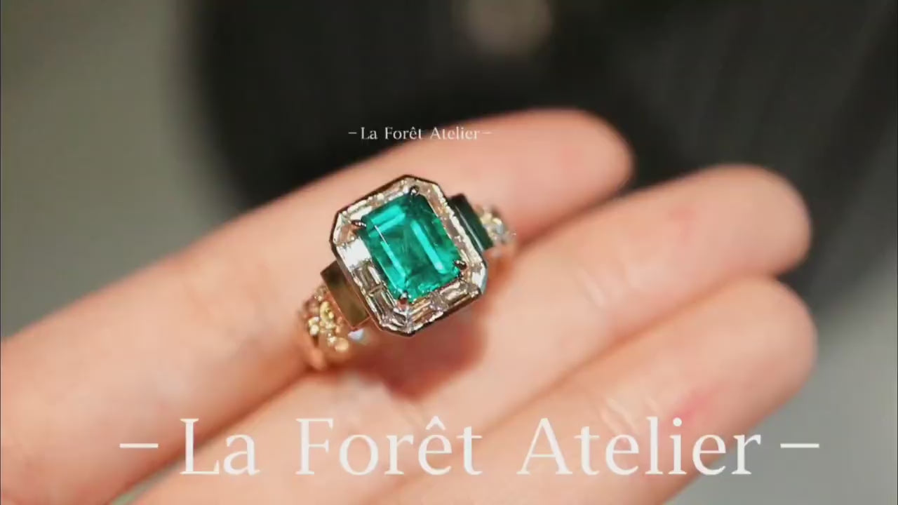 Close-up of 1.5ct lab-grown emerald ring in vintage setting