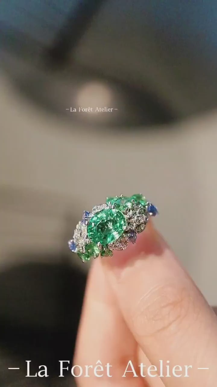 Verda Bloom ring with lab tsavorite, diamonds, and tanzanites
