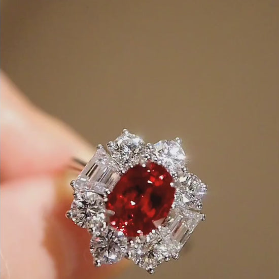 Oval red gemstone cluster ring in white gold finish

