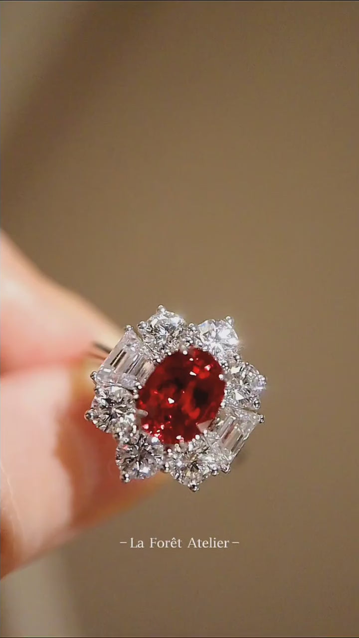 Oval red gemstone cluster ring in white gold finish

