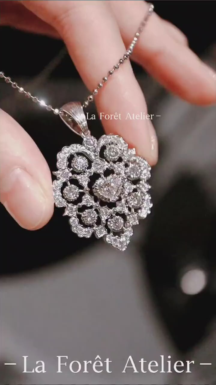 Floral filigree necklace featuring heart-shaped lab diamond