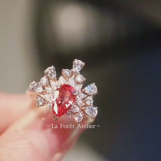 Crown-style floral ring featuring lab diamonds and pink sapphire

