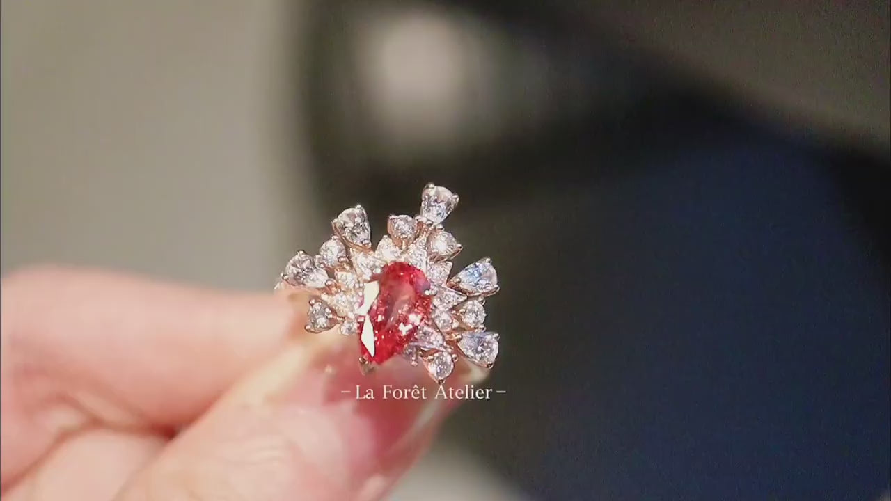 Crown-style floral ring featuring lab diamonds and pink sapphire

