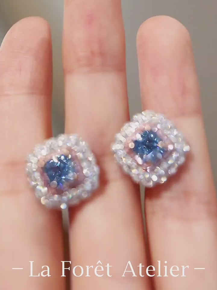 Celestara earrings with lab-grown blue diamonds and scalloped double halos








