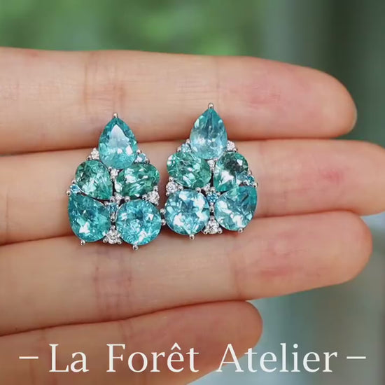 Cluster drop earrings featuring pear and round cut natural apatites with white stone accents








