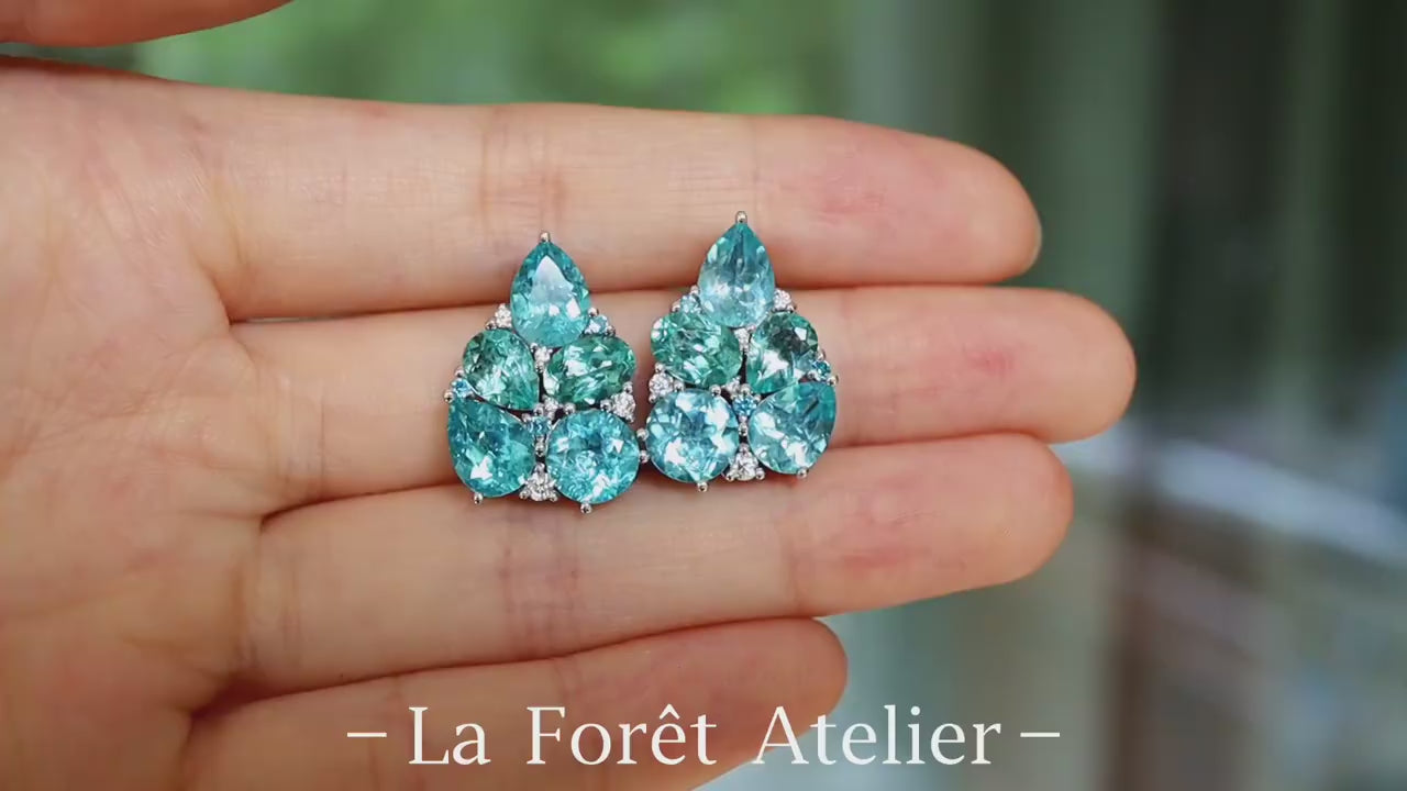 Cluster drop earrings featuring pear and round cut natural apatites with white stone accents









