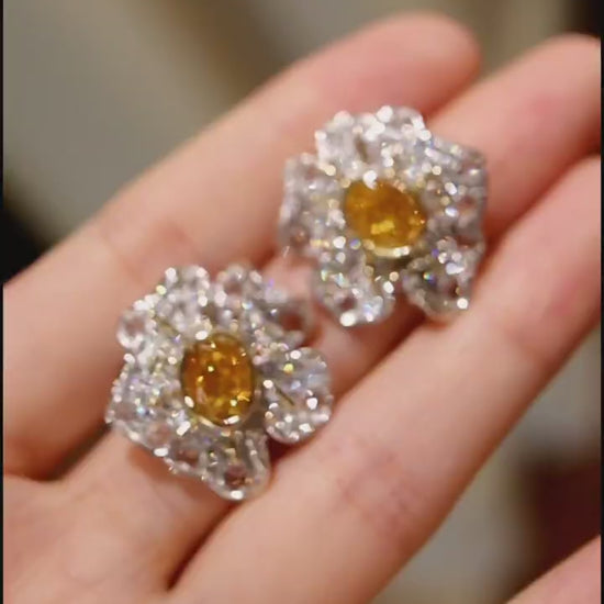 Flora Aurelia earrings feature 1ct lab-grown yellow diamonds with rose-cut lab diamond petals in a radiant floral design.








