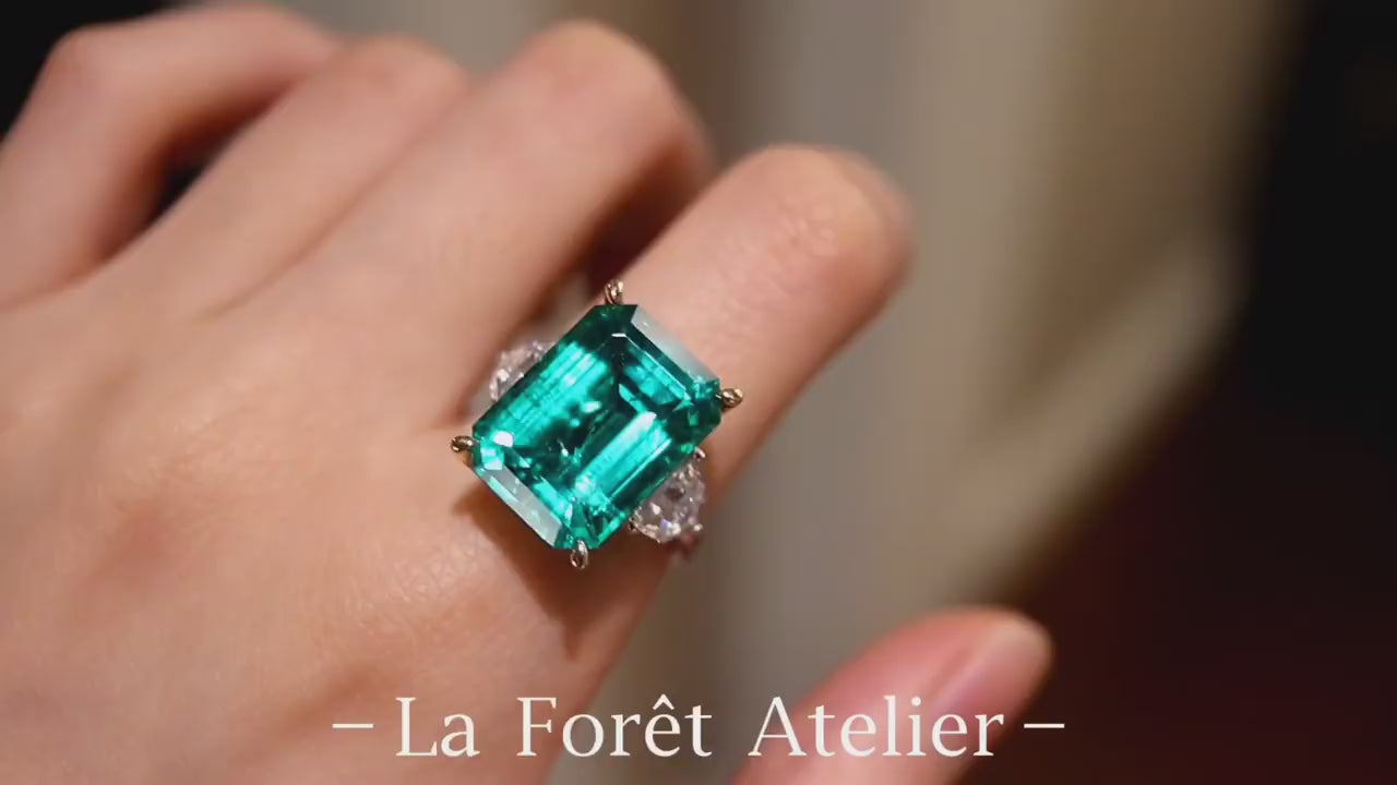 Vaetia ring with 10ct lab grown emerald and side diamonds in gold setting









