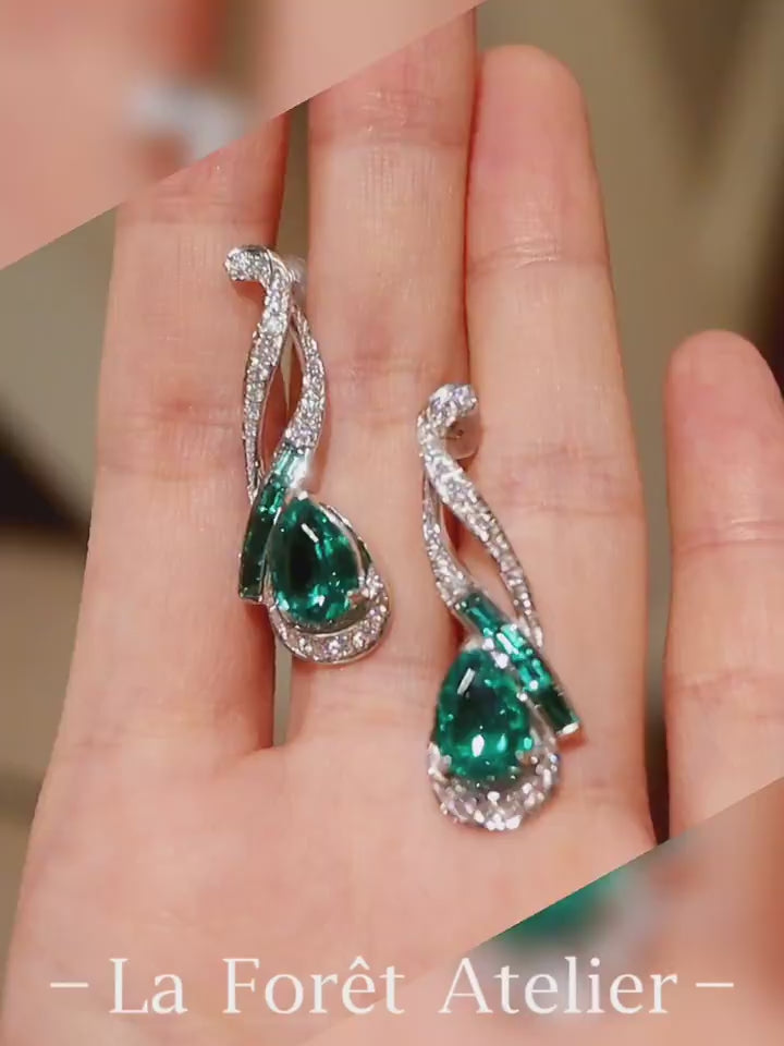 Nyelle earrings with 2ct lab emerald teardrops, baguette accents and pavé setting








