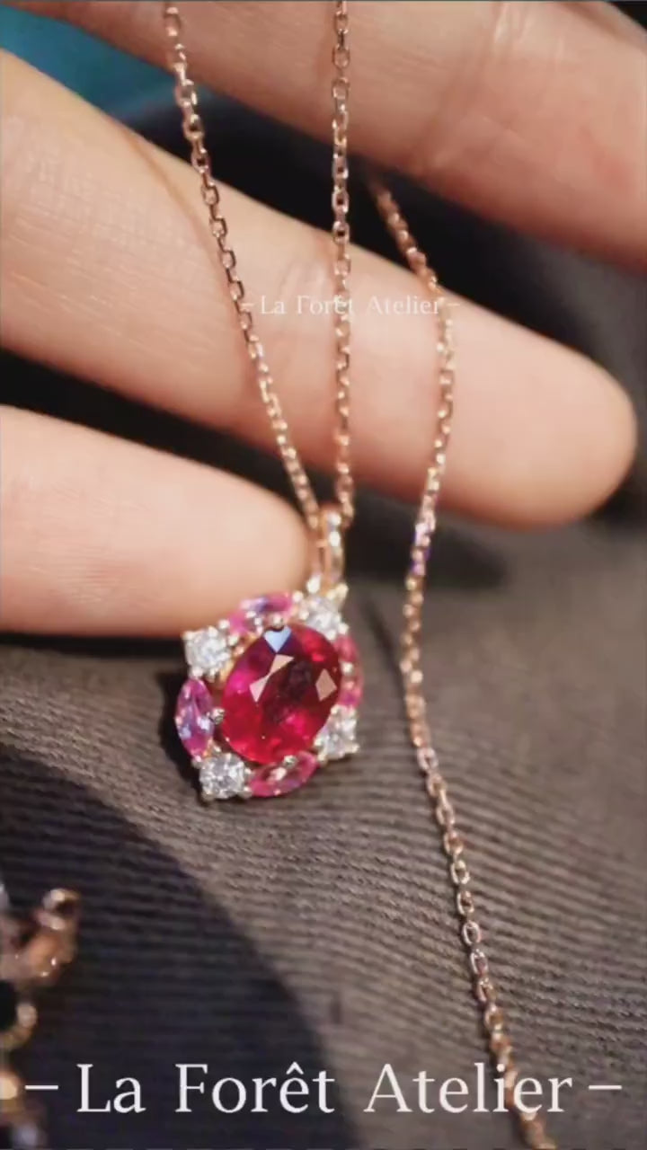 Lab ruby halo pendant with pink sapphires and diamonds








