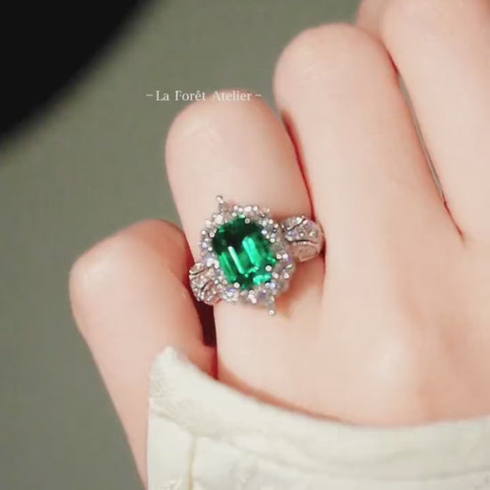 3ct lab emerald halo ring with split shank and lab diamonds in platinum setting








