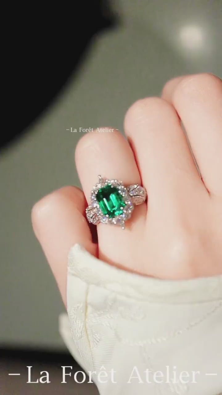 3ct lab emerald halo ring with split shank and lab diamonds in platinum setting








