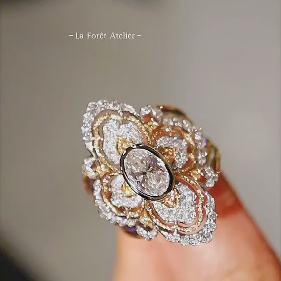 Oval lab diamond ring with pavé quatrefoil motif

