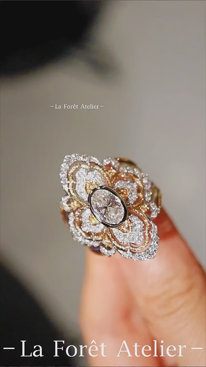 Oval lab diamond ring with pavé quatrefoil motif

