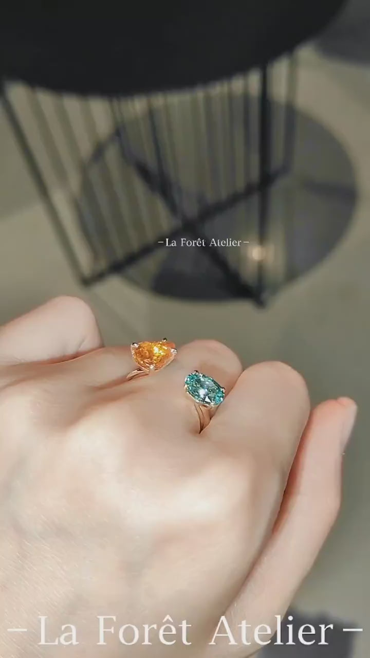 Solari open ring with orange Fanta garnet and blue paraiba tourmaline in gold setting








