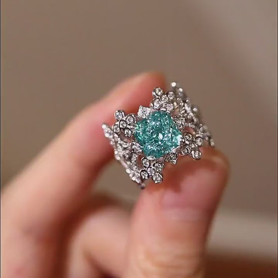 Lab grown blue diamond floral ring with intricate filigree design

