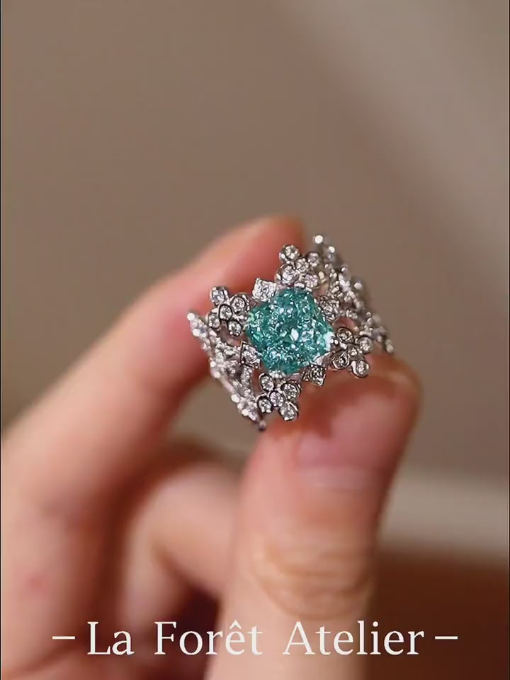 Lab grown blue diamond floral ring with intricate filigree design

