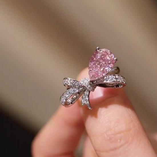Ondira ring featuring 2ct lab grown pink diamond and pavé bow design in white gold








