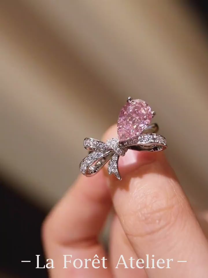 Ondira ring featuring 2ct lab grown pink diamond and pavé bow design in white gold








