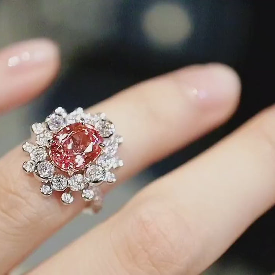 Lab-grown padparadscha cocktail ring with floral diamond design








