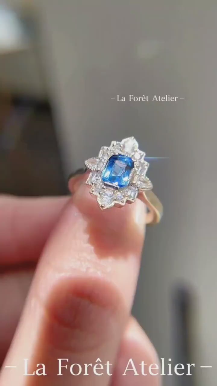 Lab-grown blue sapphire ring with floral diamond halo design








